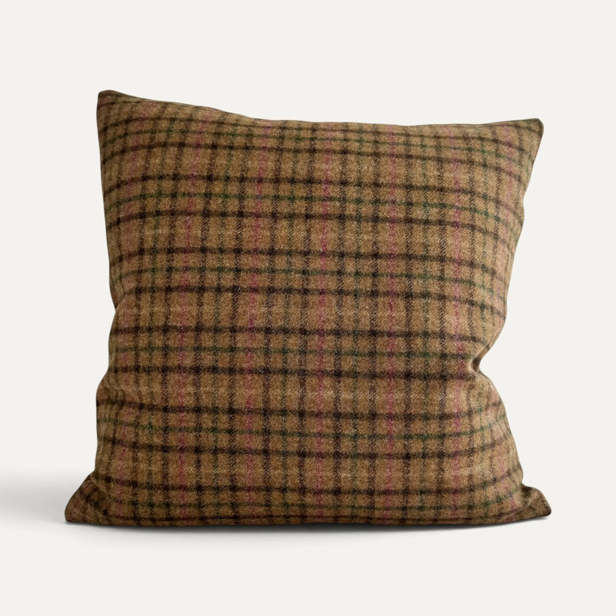 Hazel wool cushion cover in a small tobacco brown check with fine pine green and raspberry lines, on a white background