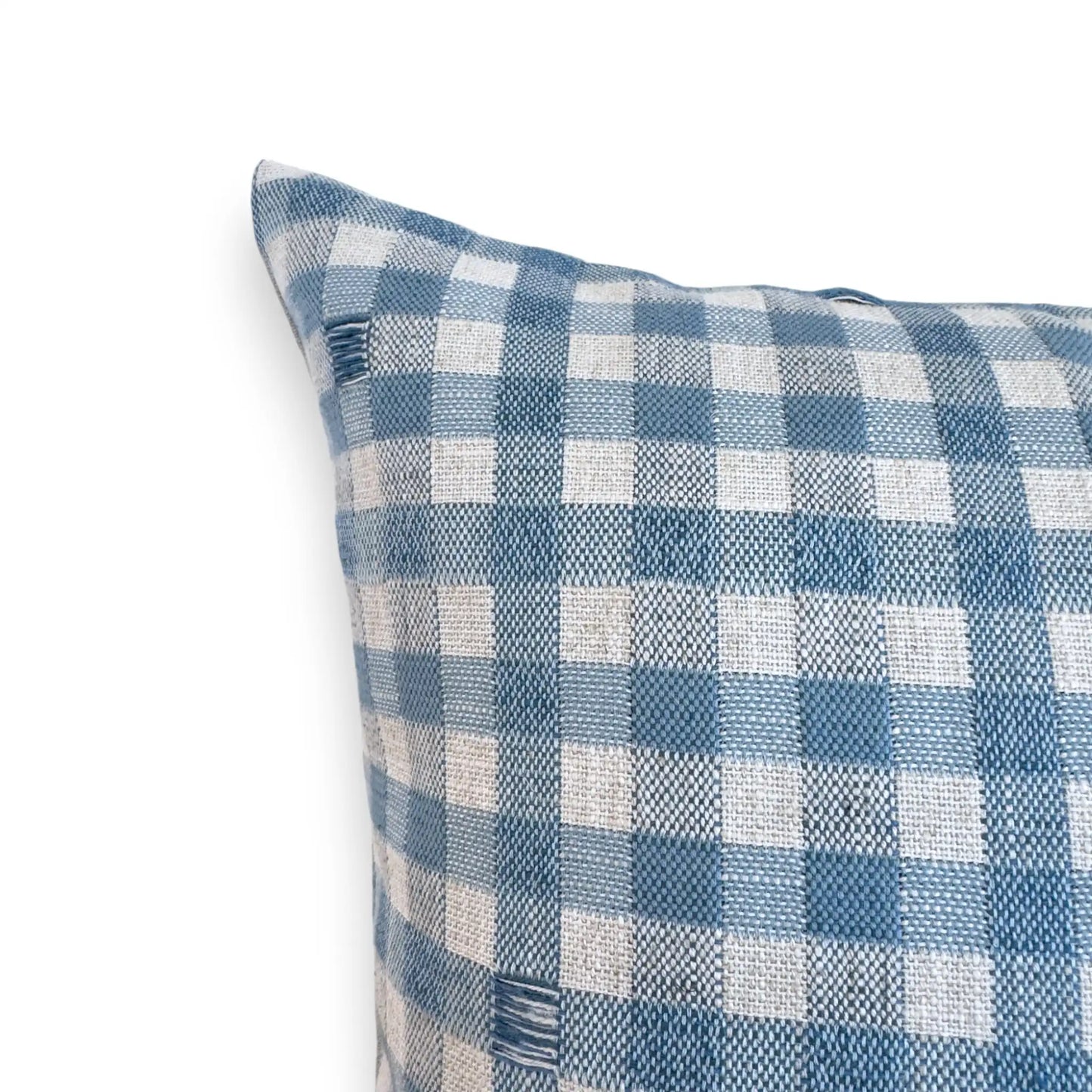 Detail view of light blue checkered cushion
