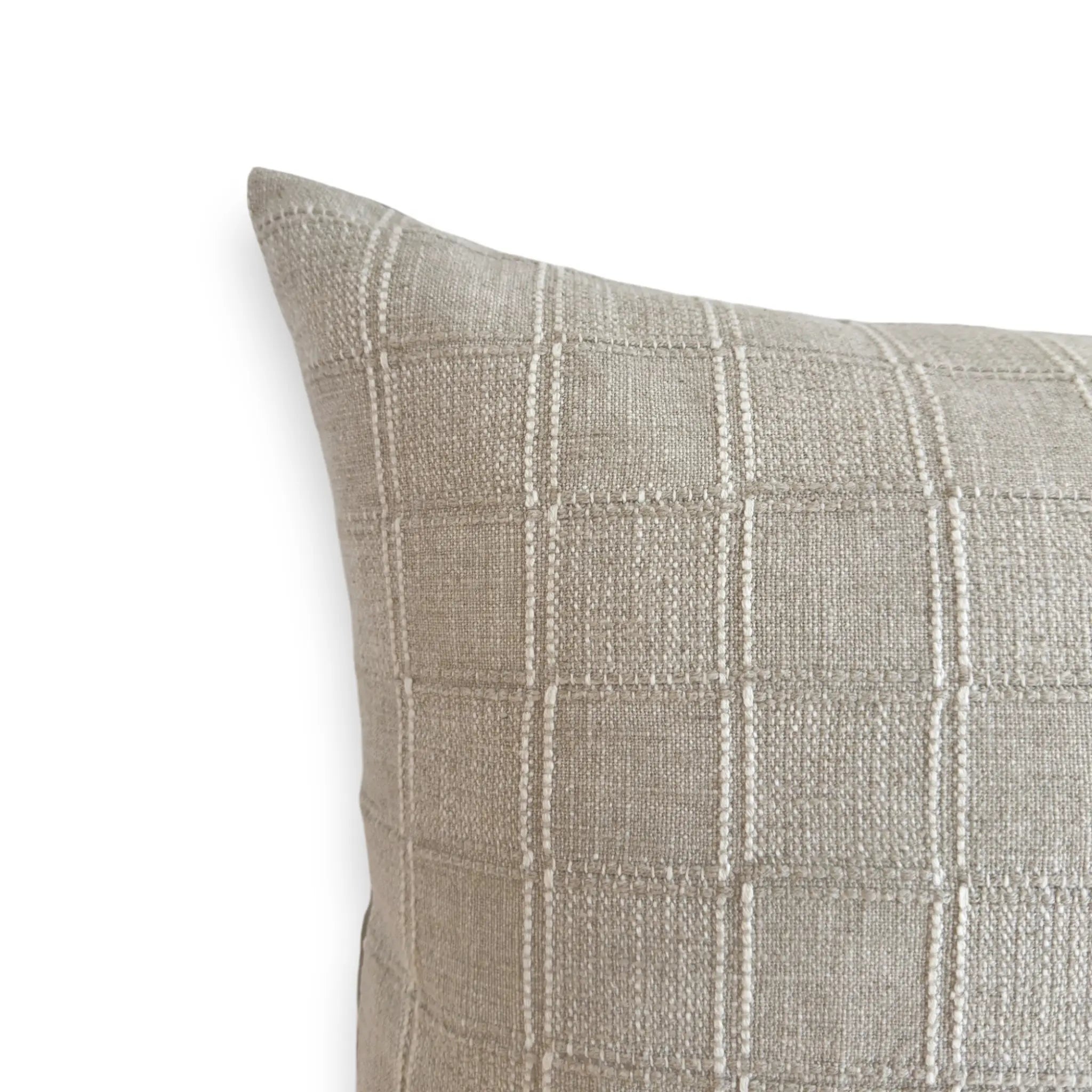 Detail view of checkered linen blend cushion cover in cream