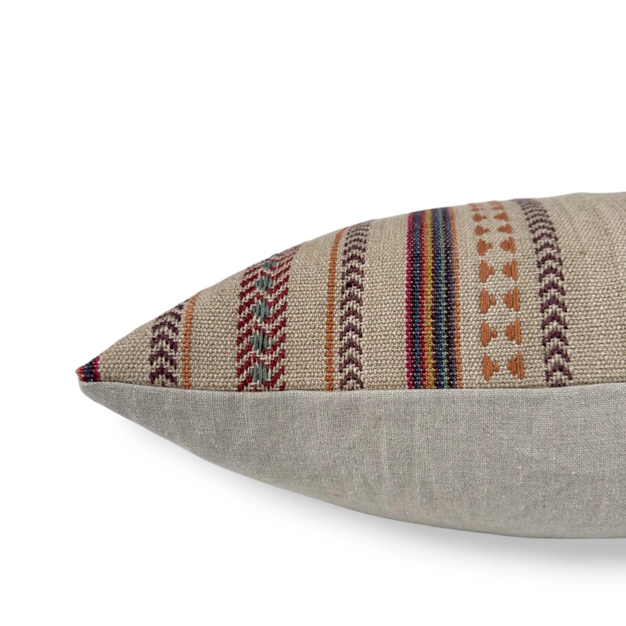 Side view of a natural bohemian cushion in cotton and jute