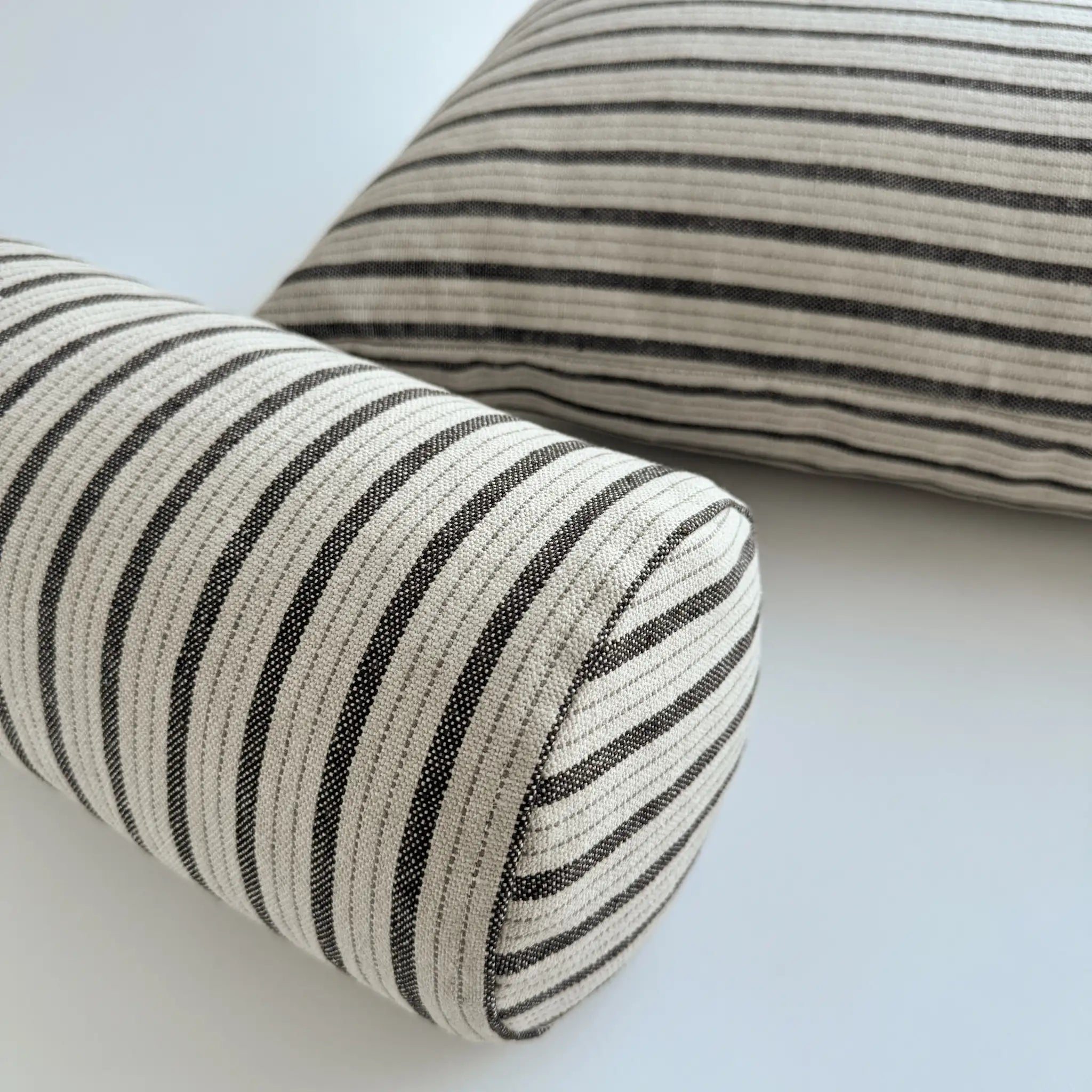 Black and white striped bolster pillow