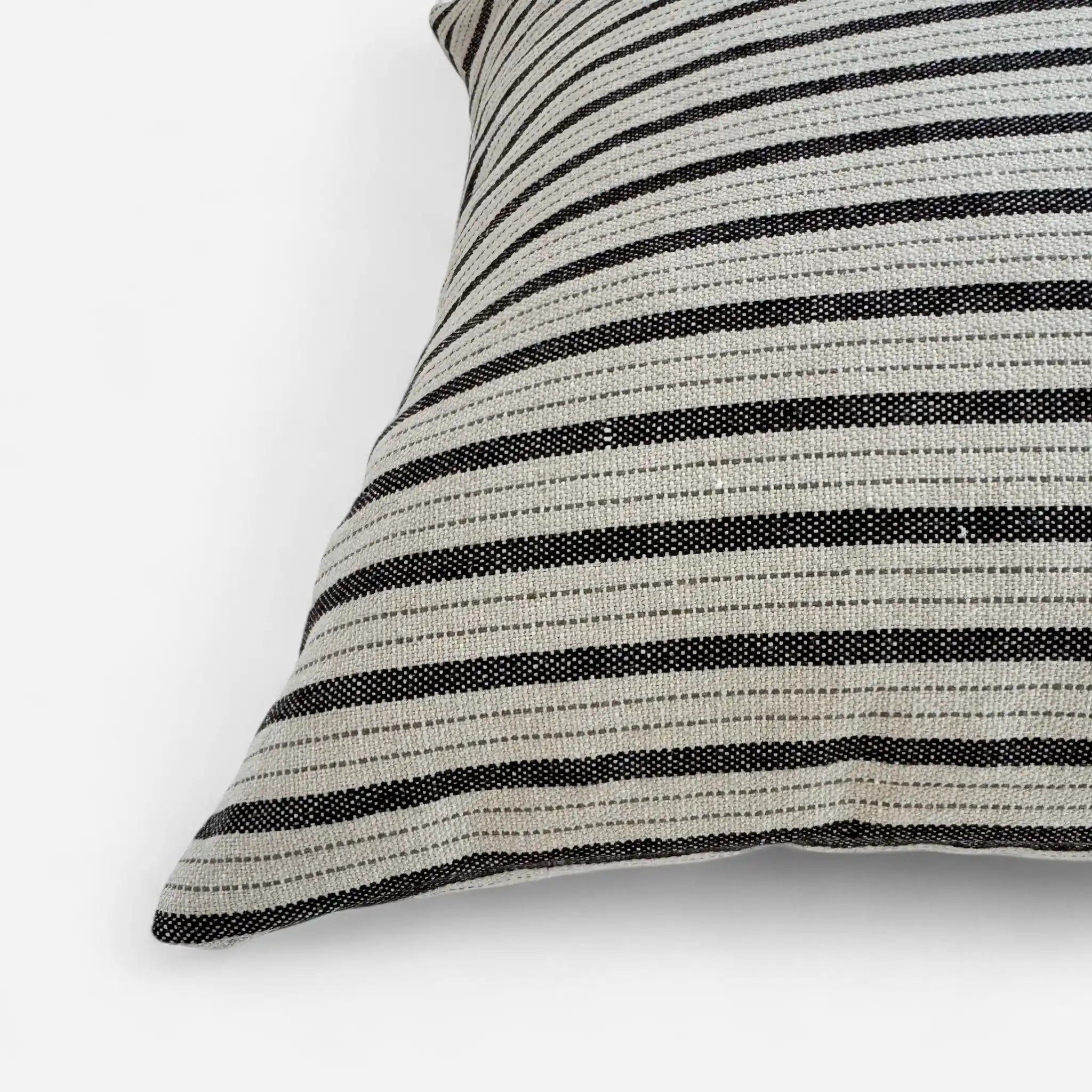 Detail view of black and white striped cushion