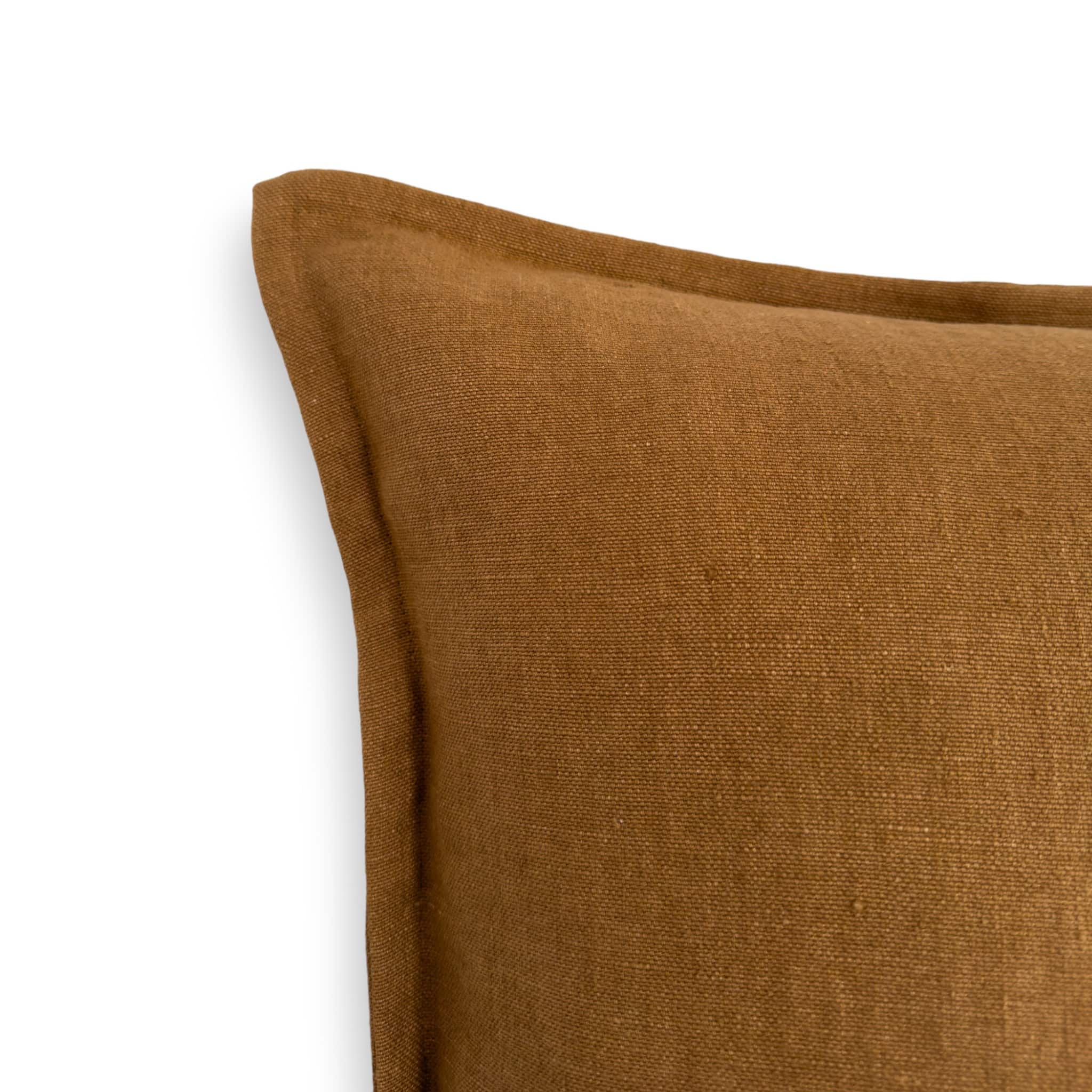 Detail view of brown linen cushion cover