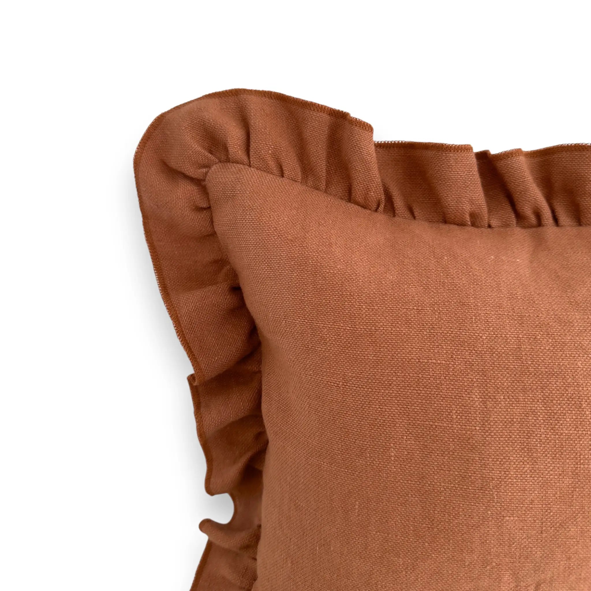 Detail view of terracotta ruffle linen cushion cover