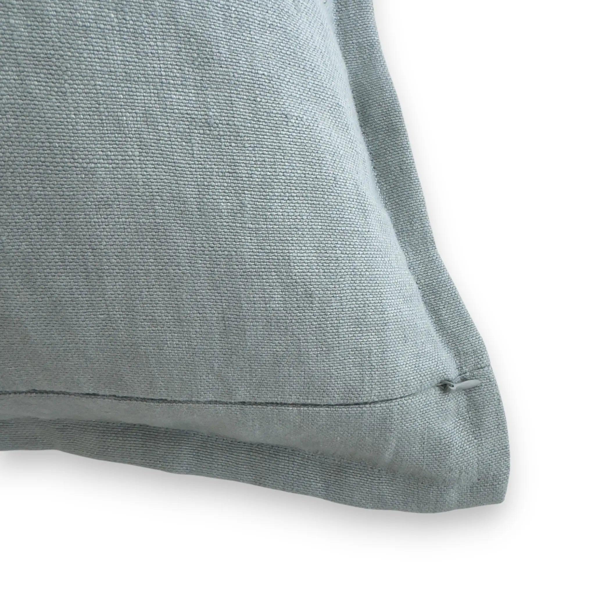 Detail view of duck egg blue linen cushion cover with concealed zipper