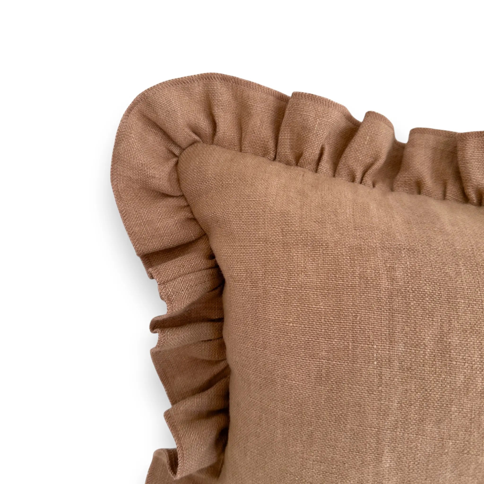 Detail view of brown linen frill cushion cover