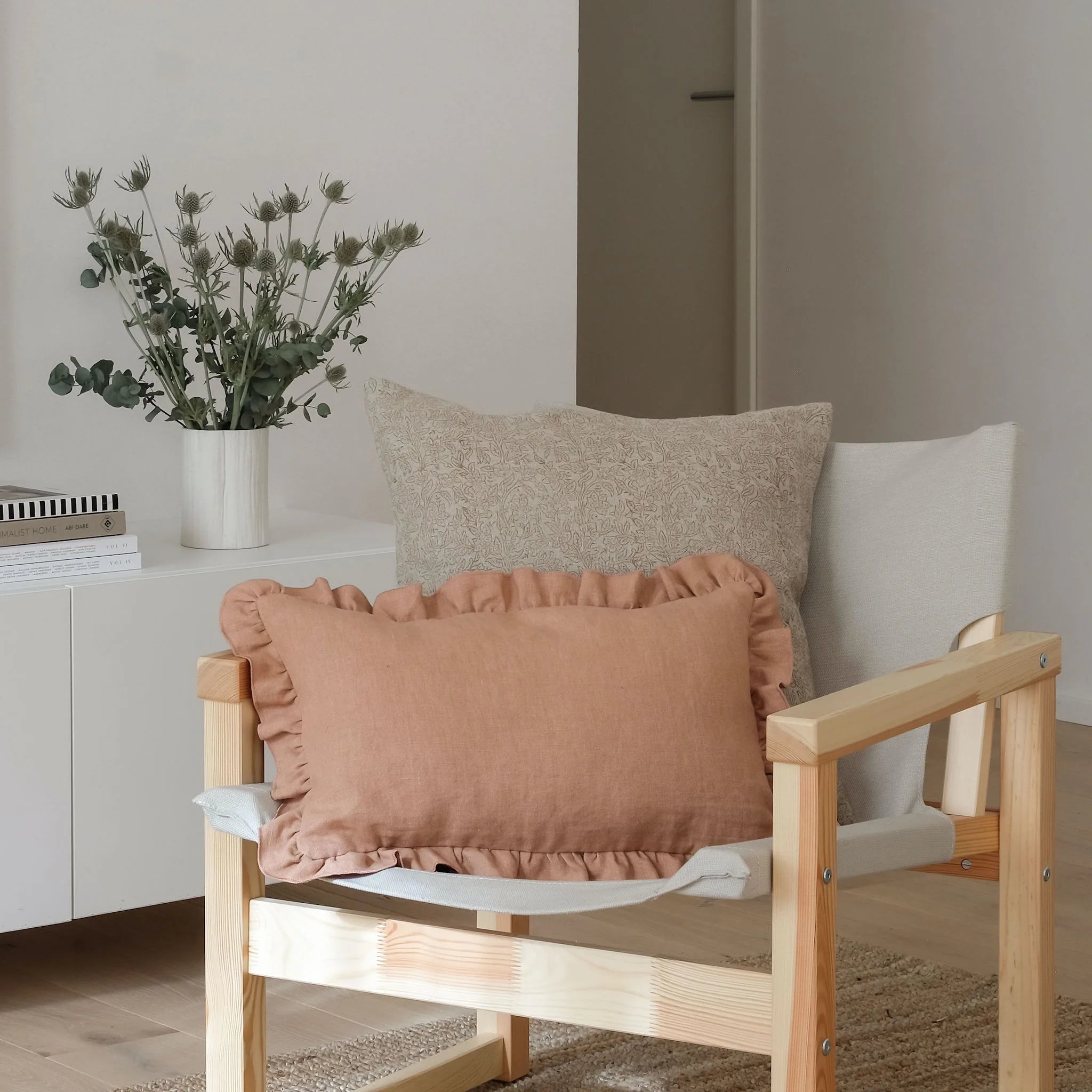 Neutral cushions styled on white chair