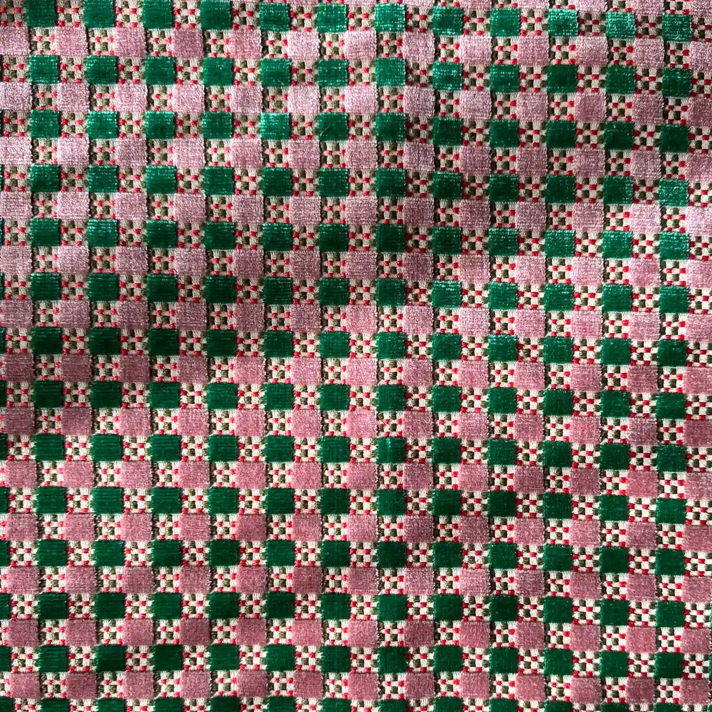 Closeup of the Nina Campbell Theodora fabric in Jade and Pink colour