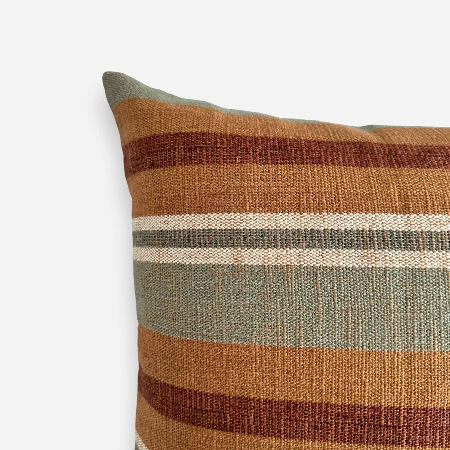 Detail view of cotton and jute textured cushion cover in sage green and orange colours