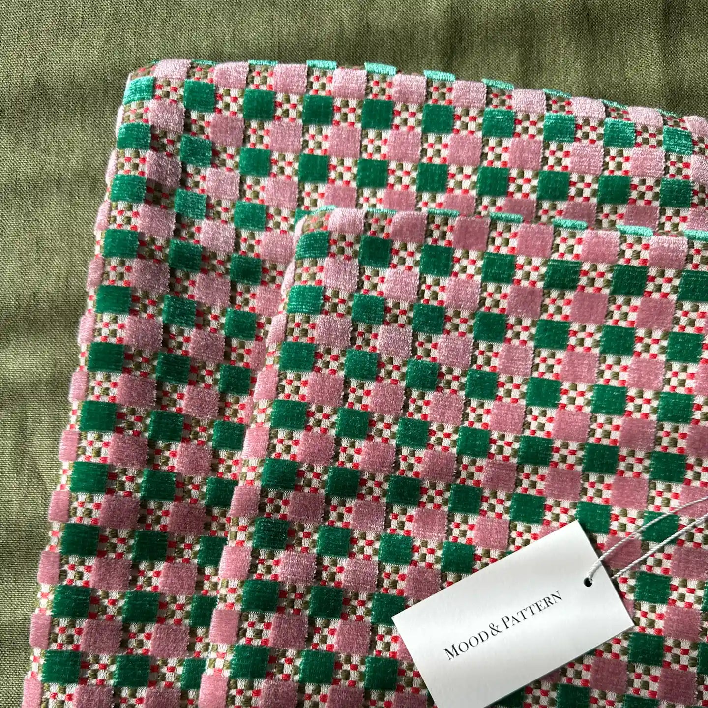 Pink and green velvet check cushion covers with mood and pattern brand tag visible