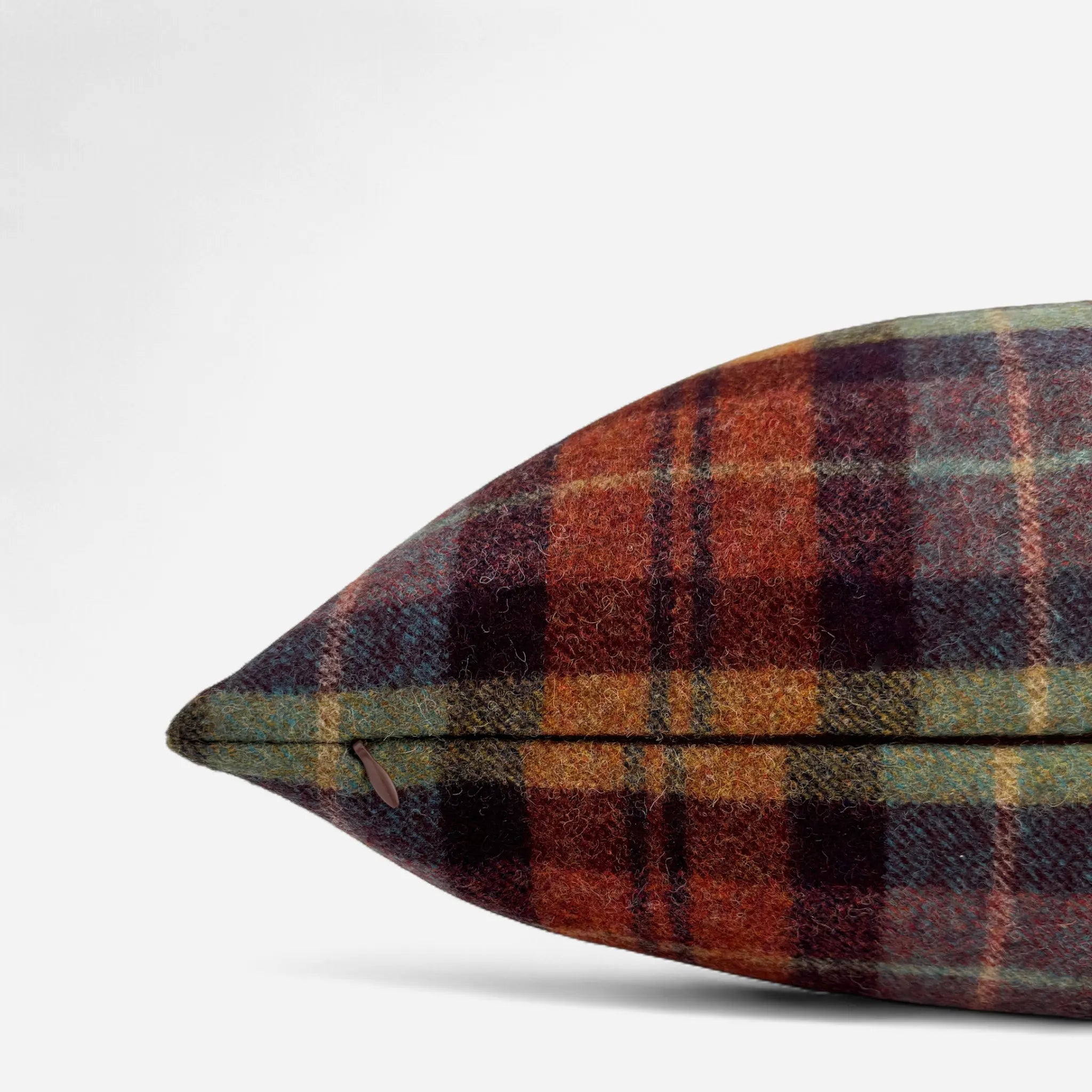 Checkered wool cushion cover in green, orange and rust