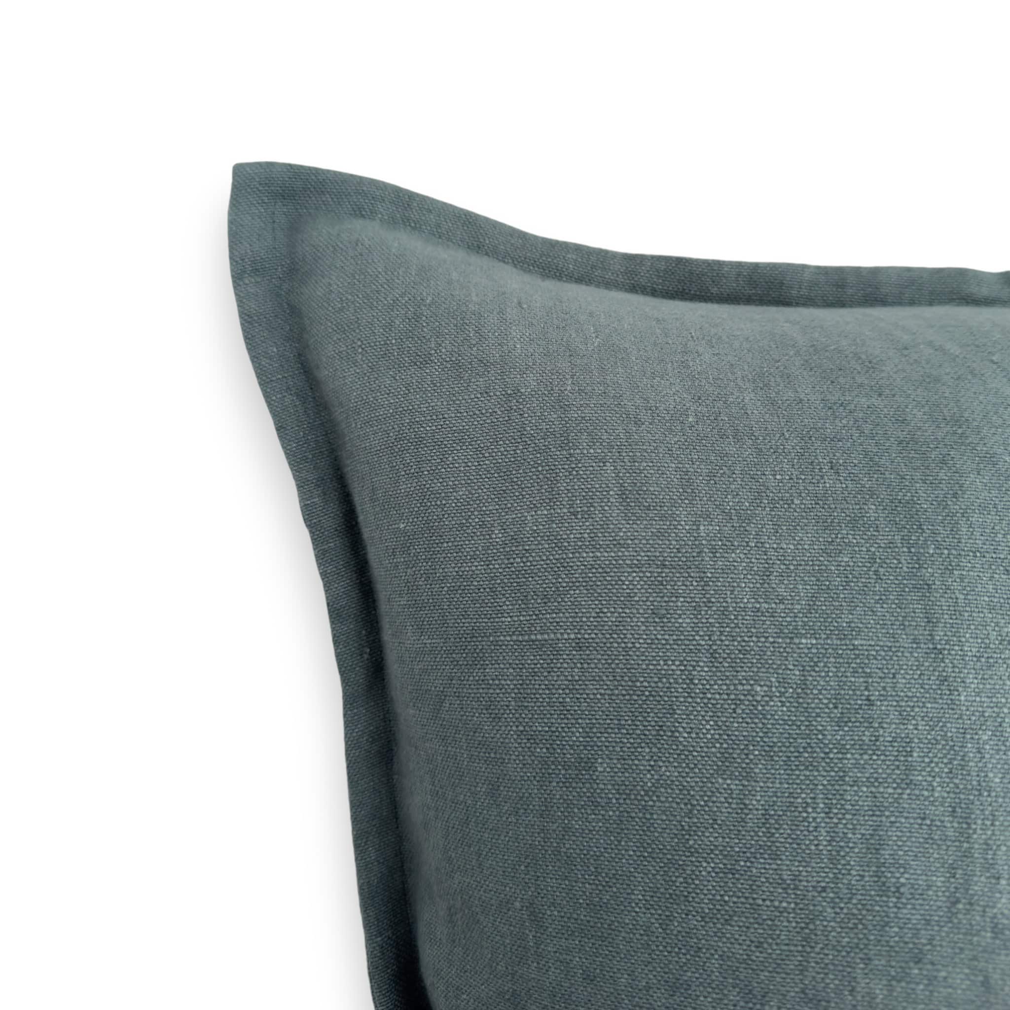 Detail view of teal linen cushion cover