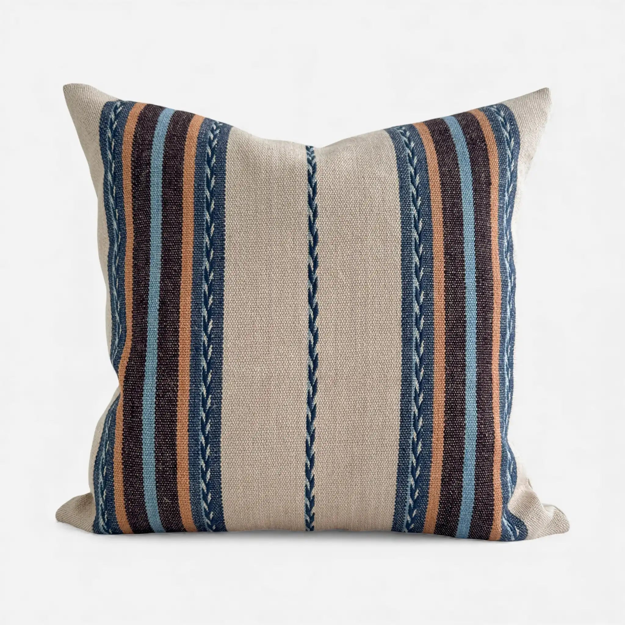 Striped boho pillow with blue, brown, and beige colours