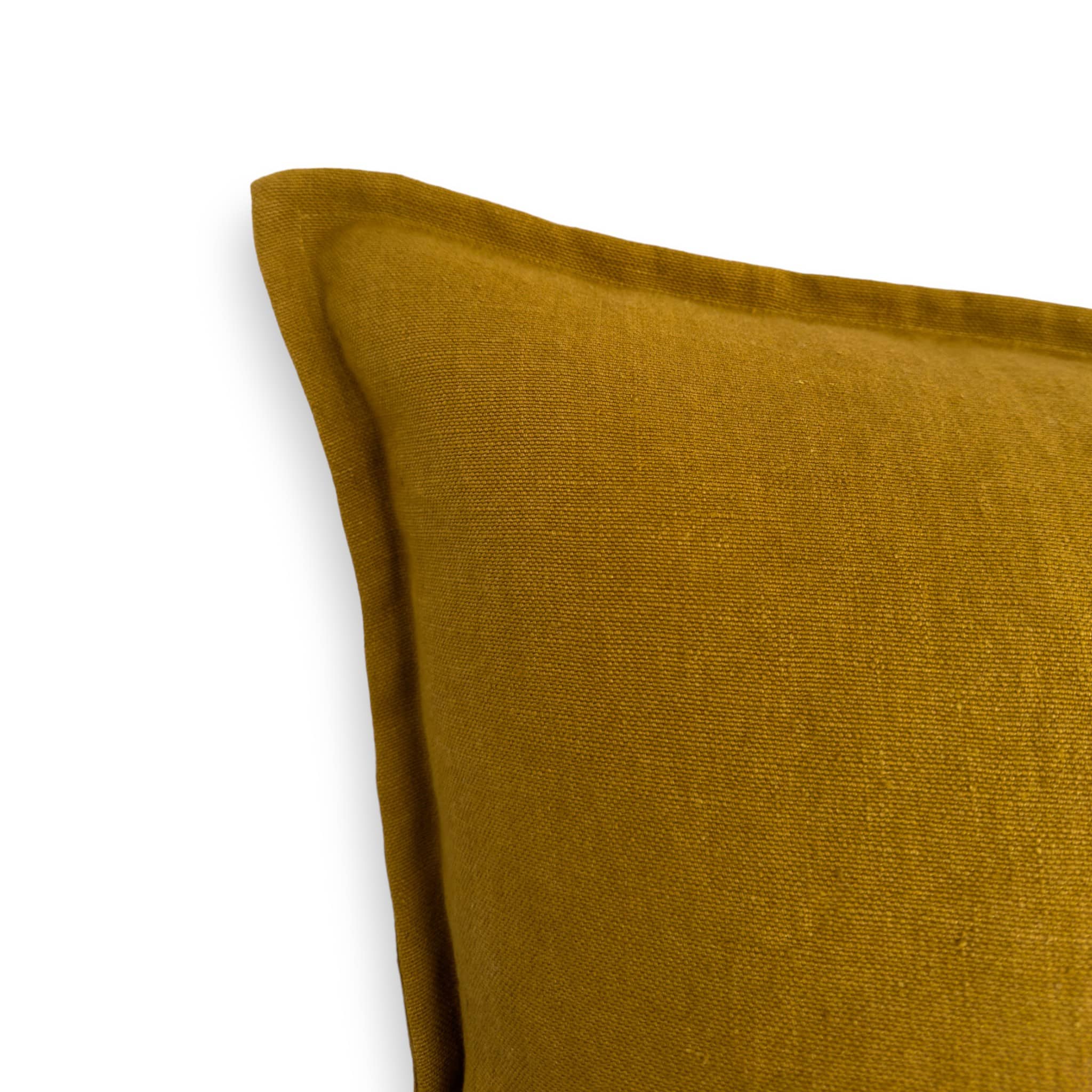 Detail view of a mustard linen cushion cover