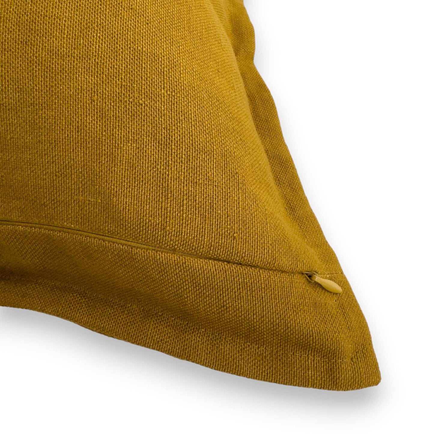 Detail view of mustard yellow linen cushion cover with concealed zipper