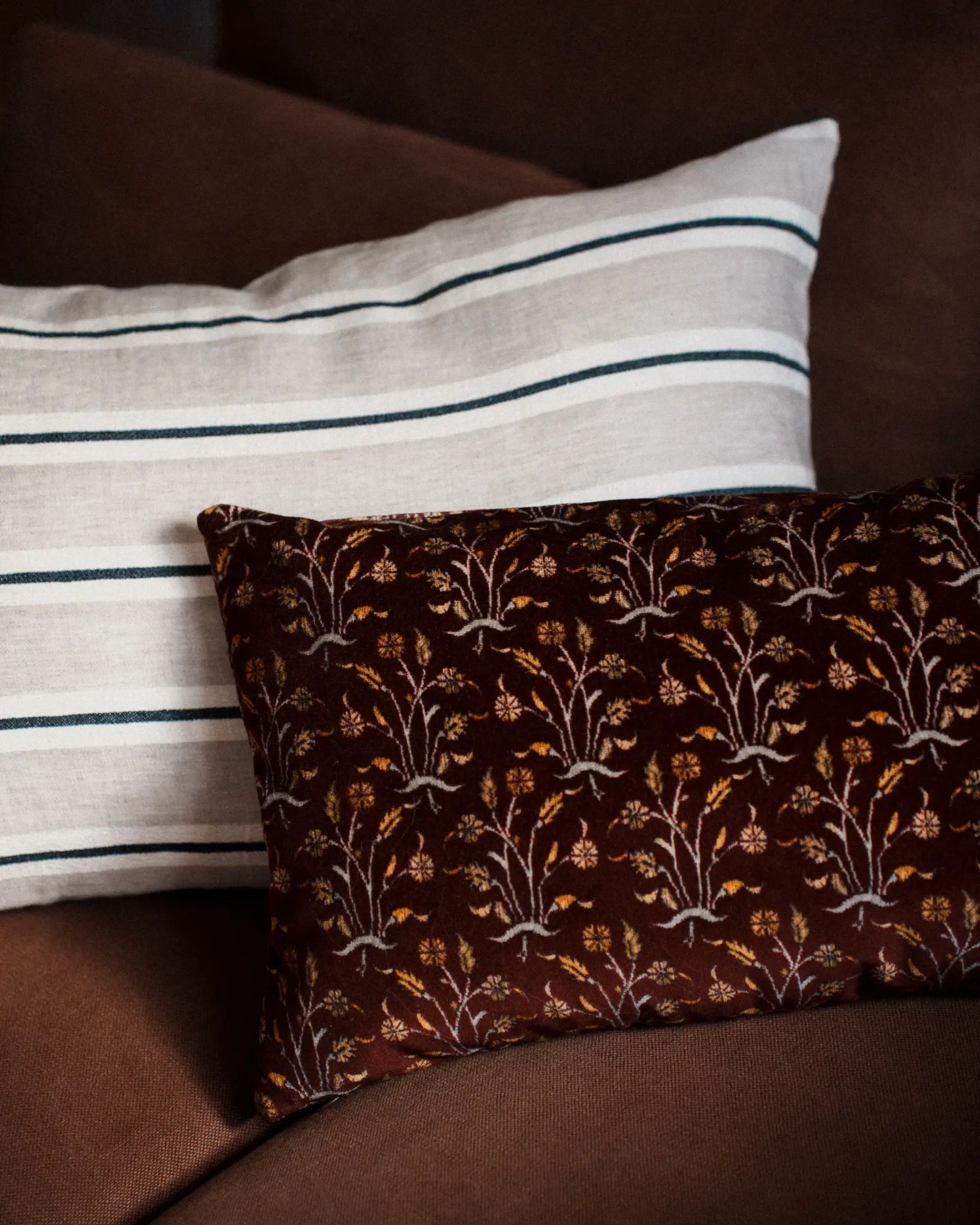 Dark red velvet cushion with floral pattern