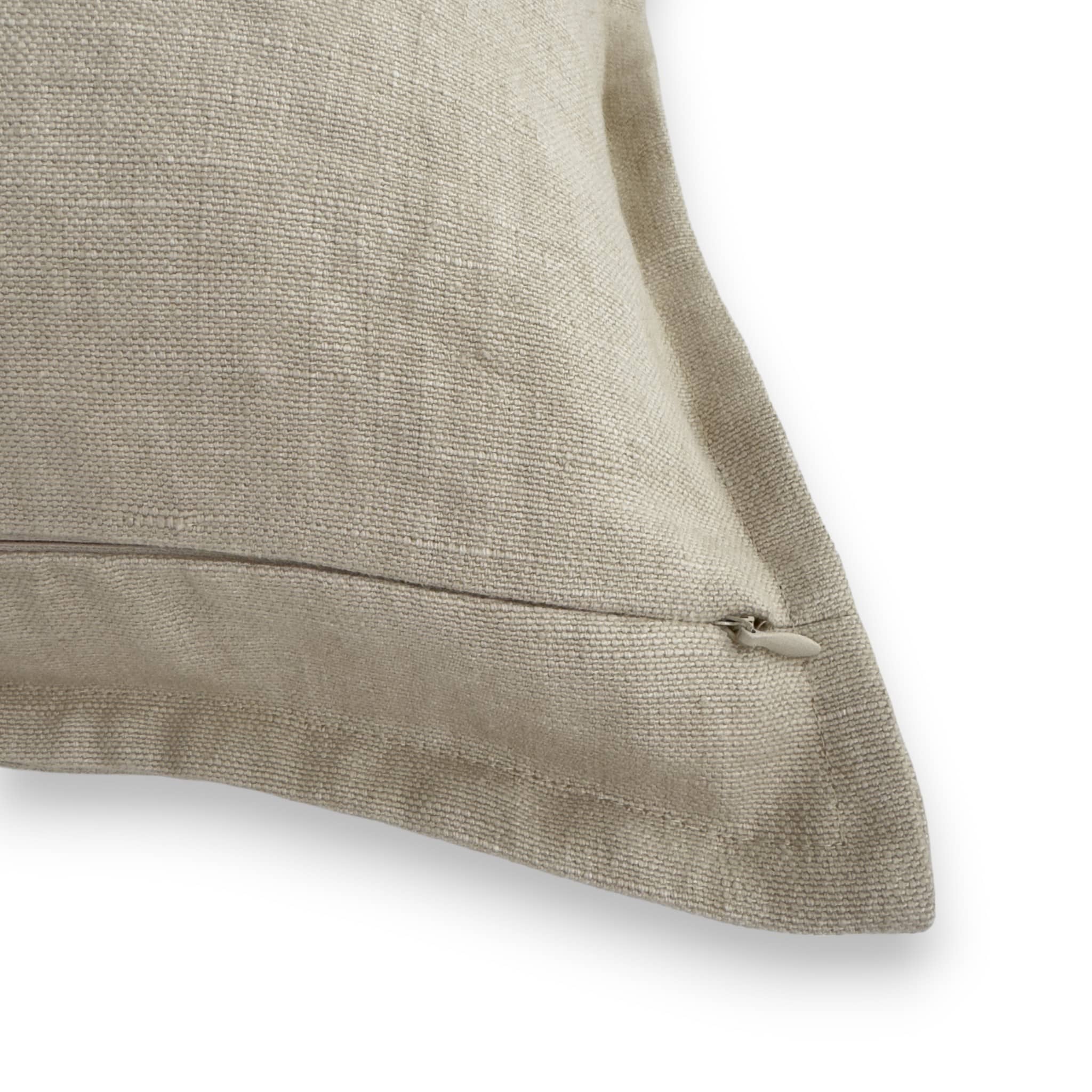 Detail view of cream linen cushion cover with concealed zipper