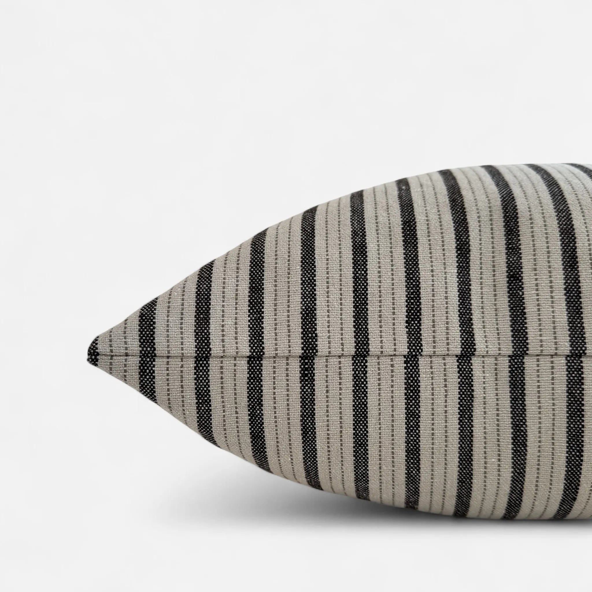 Side view of black and white striped cushion