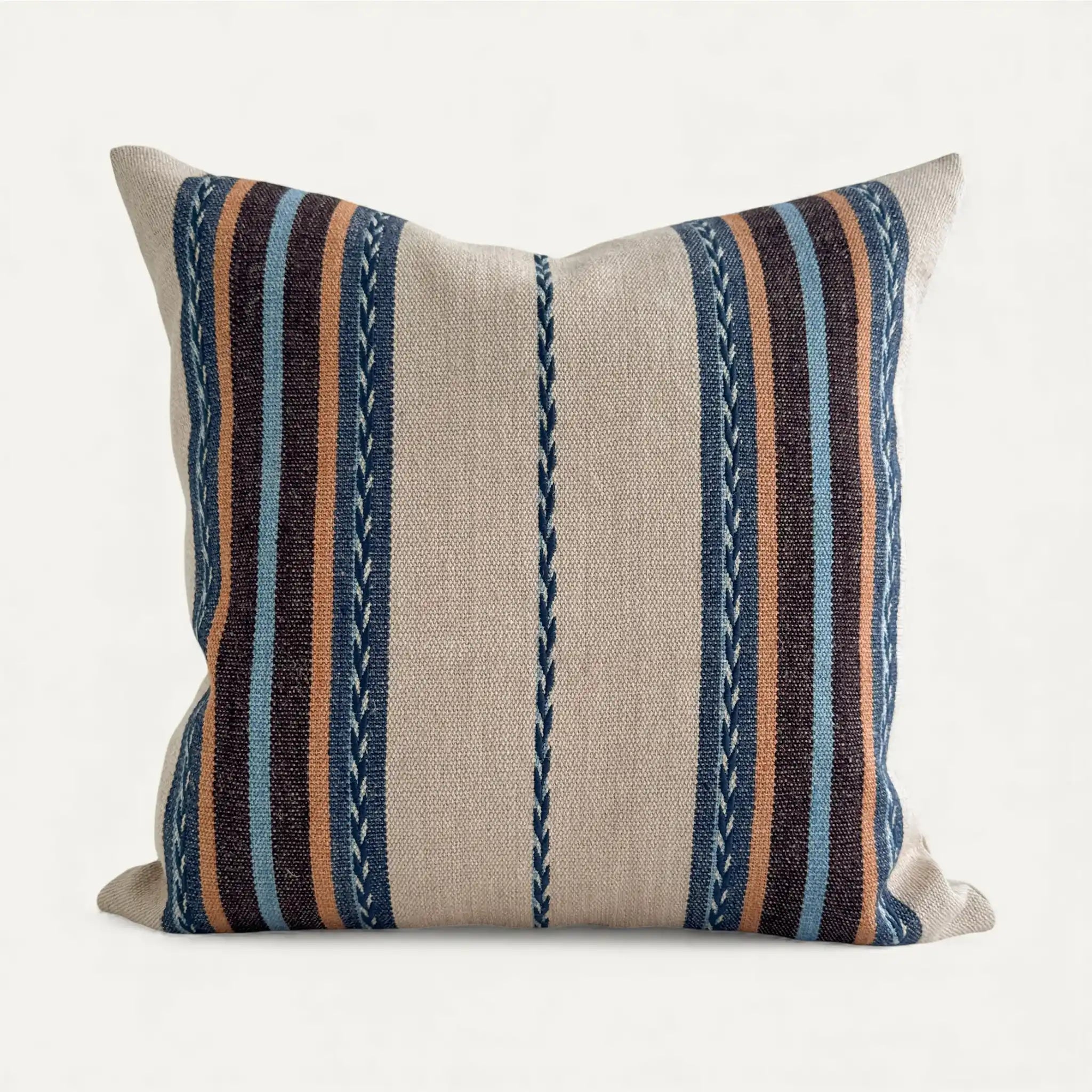 Striped boho pillow with blue, brown, and beige colours