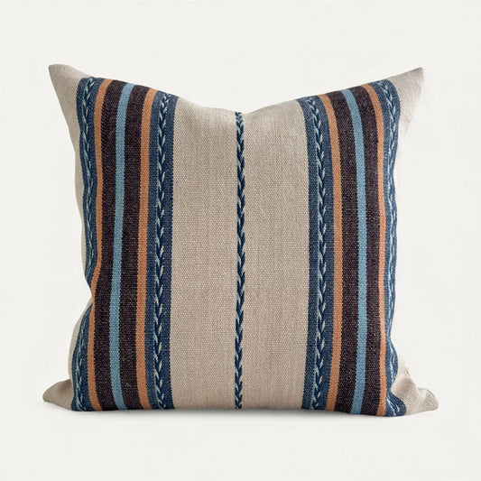 Striped boho pillow with blue, brown, and beige colours