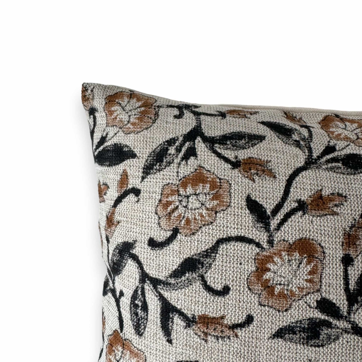 close up view of brown black floral block print cushion cover