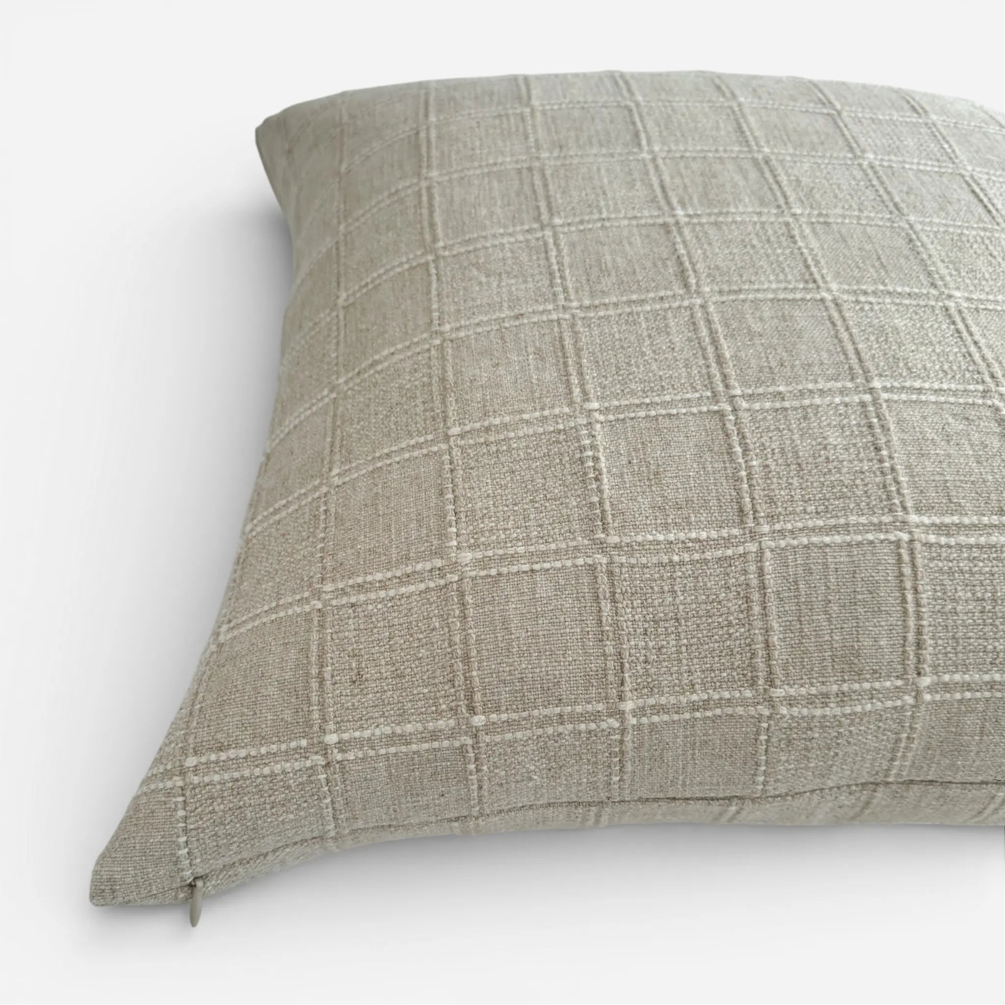 Detail view of cream coloured textured cushion cover