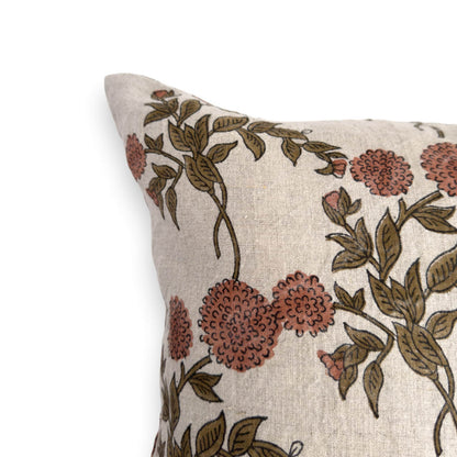 Close up view of a floral block print cushion cover