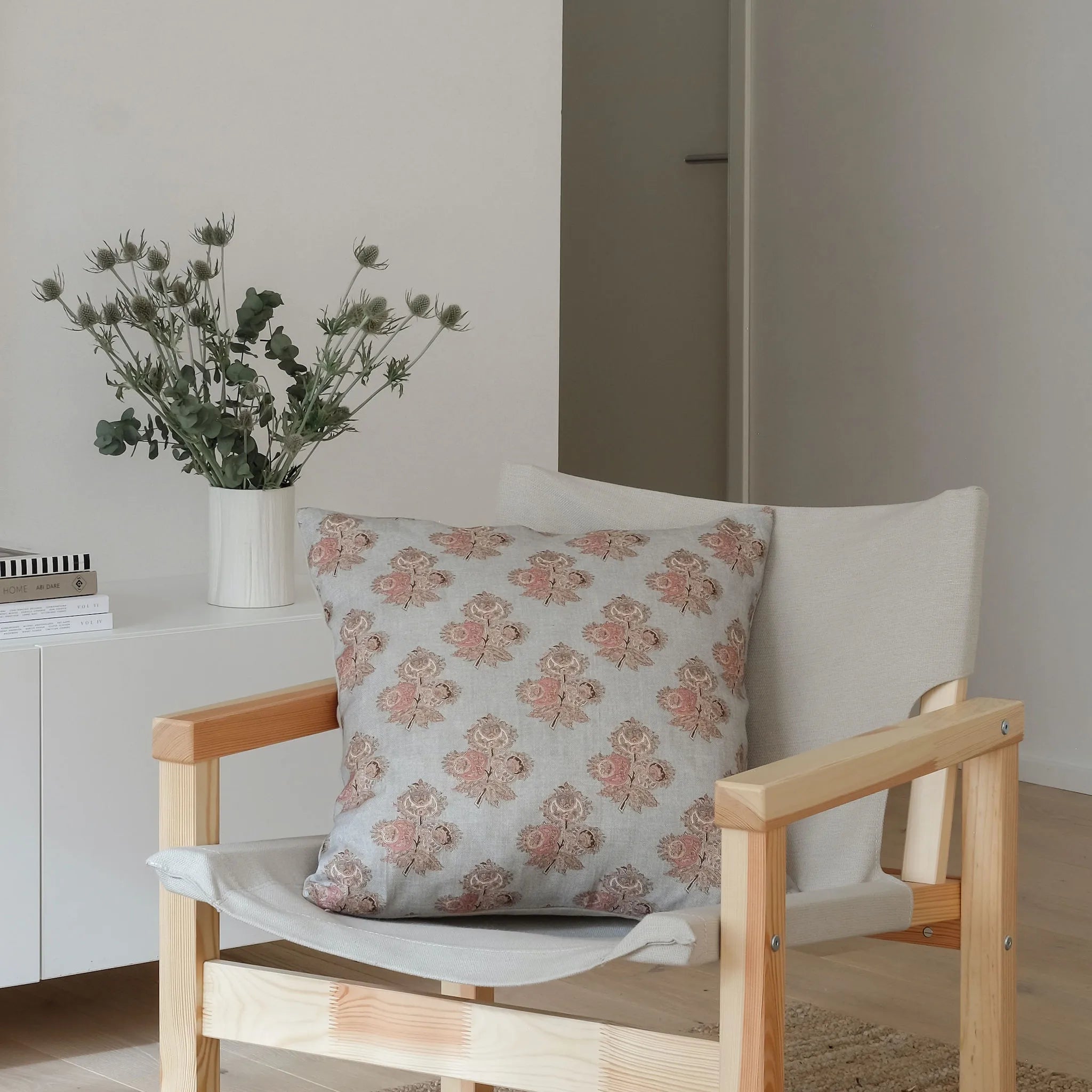 Light duck egg blue cushion styled on a chair