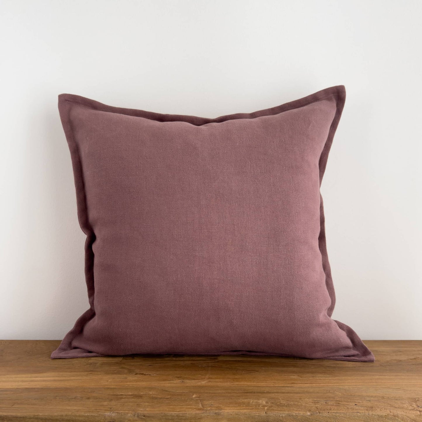 Mauve purple linen solid color cushion on a bench