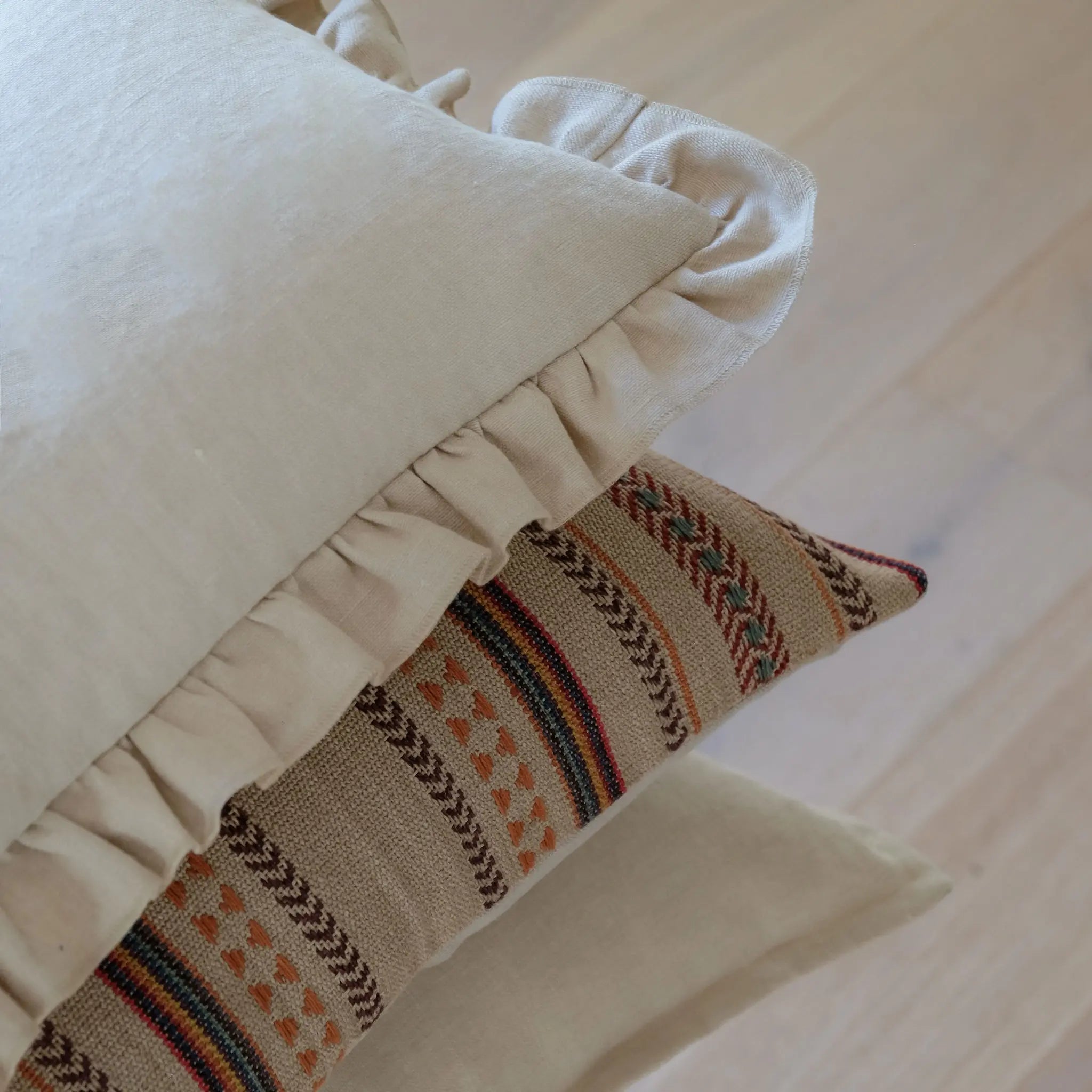 Neutral linen and jute cushion stacked