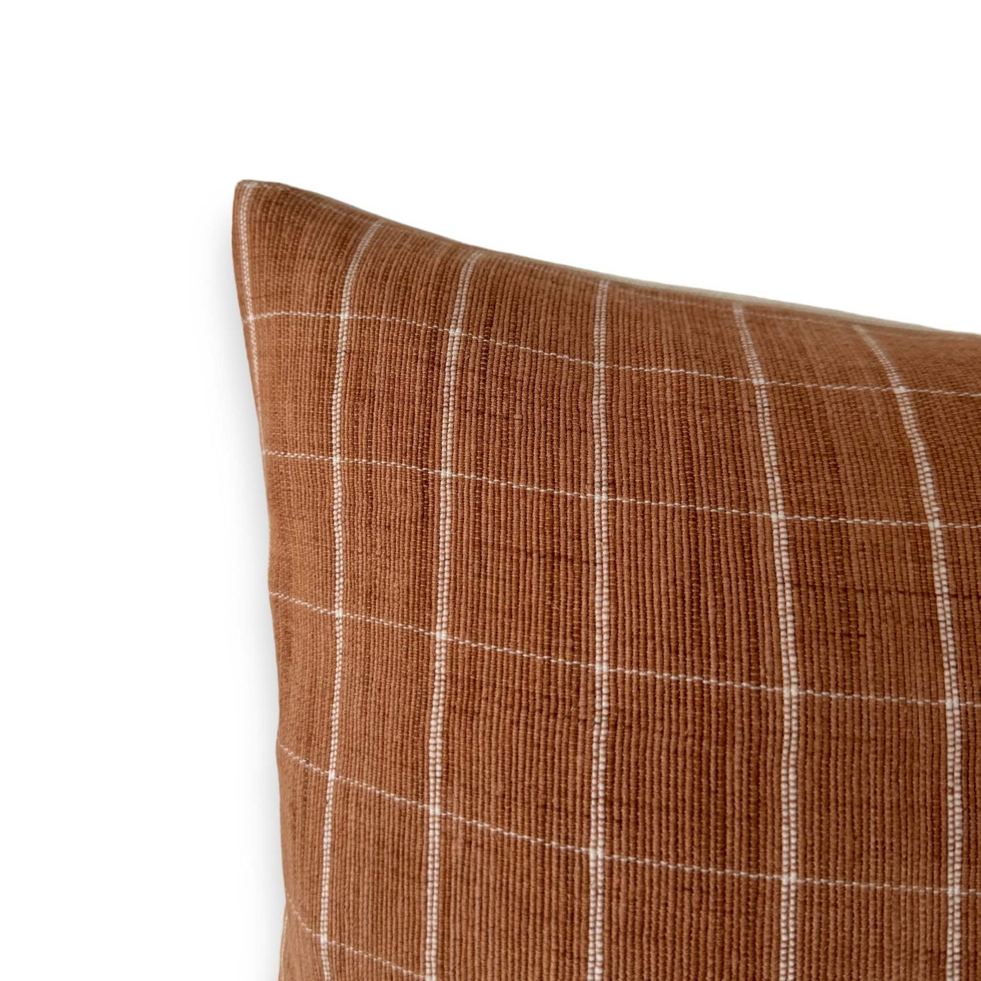 corner of orange check cushion cover