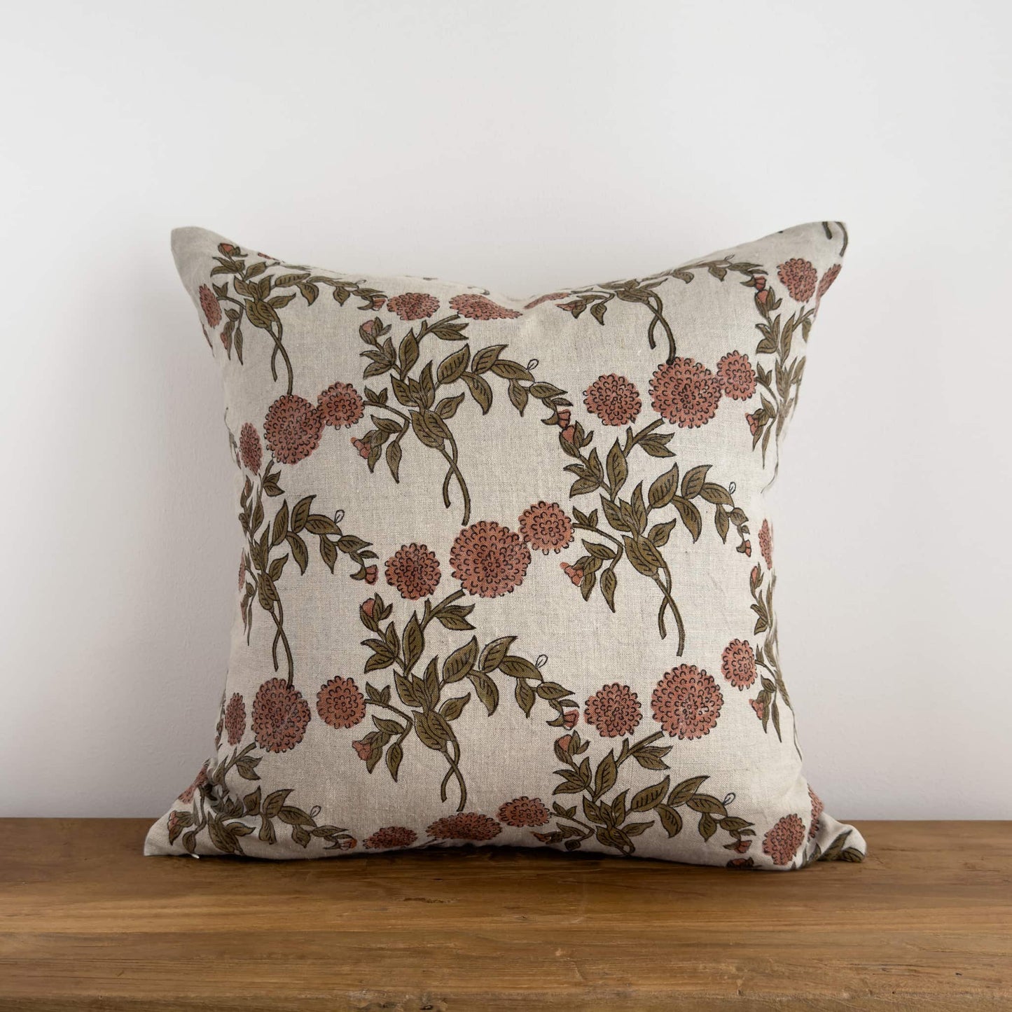 Floral block print cushion on a bench