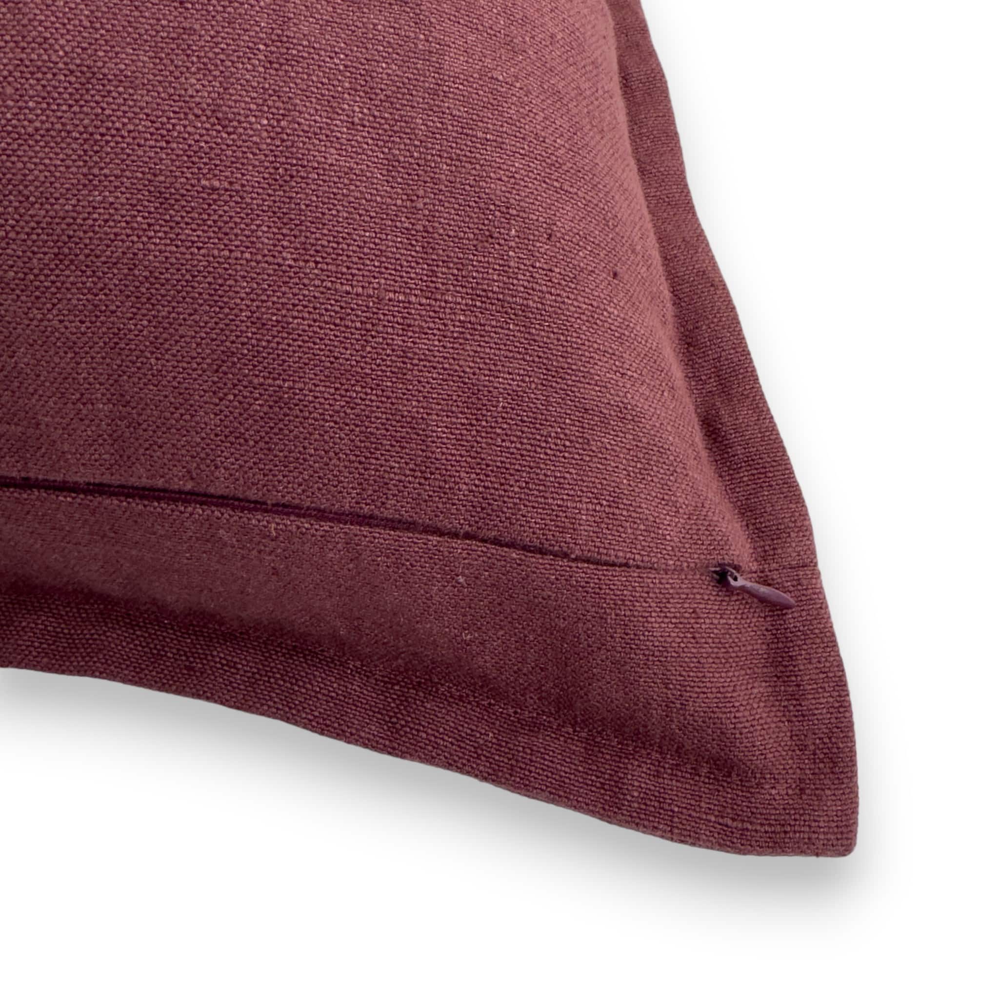 Detail view of purple stonewashed linen cushion cover with concealed zipper