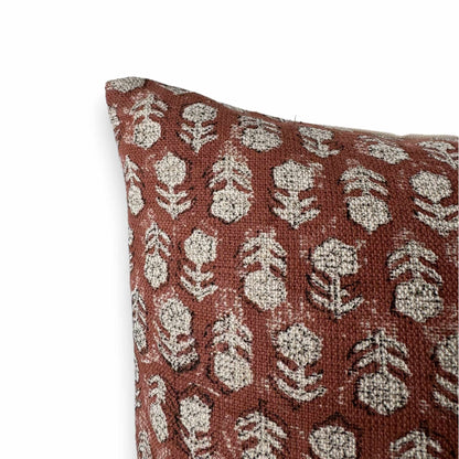 corner of dark red floral cushion cover