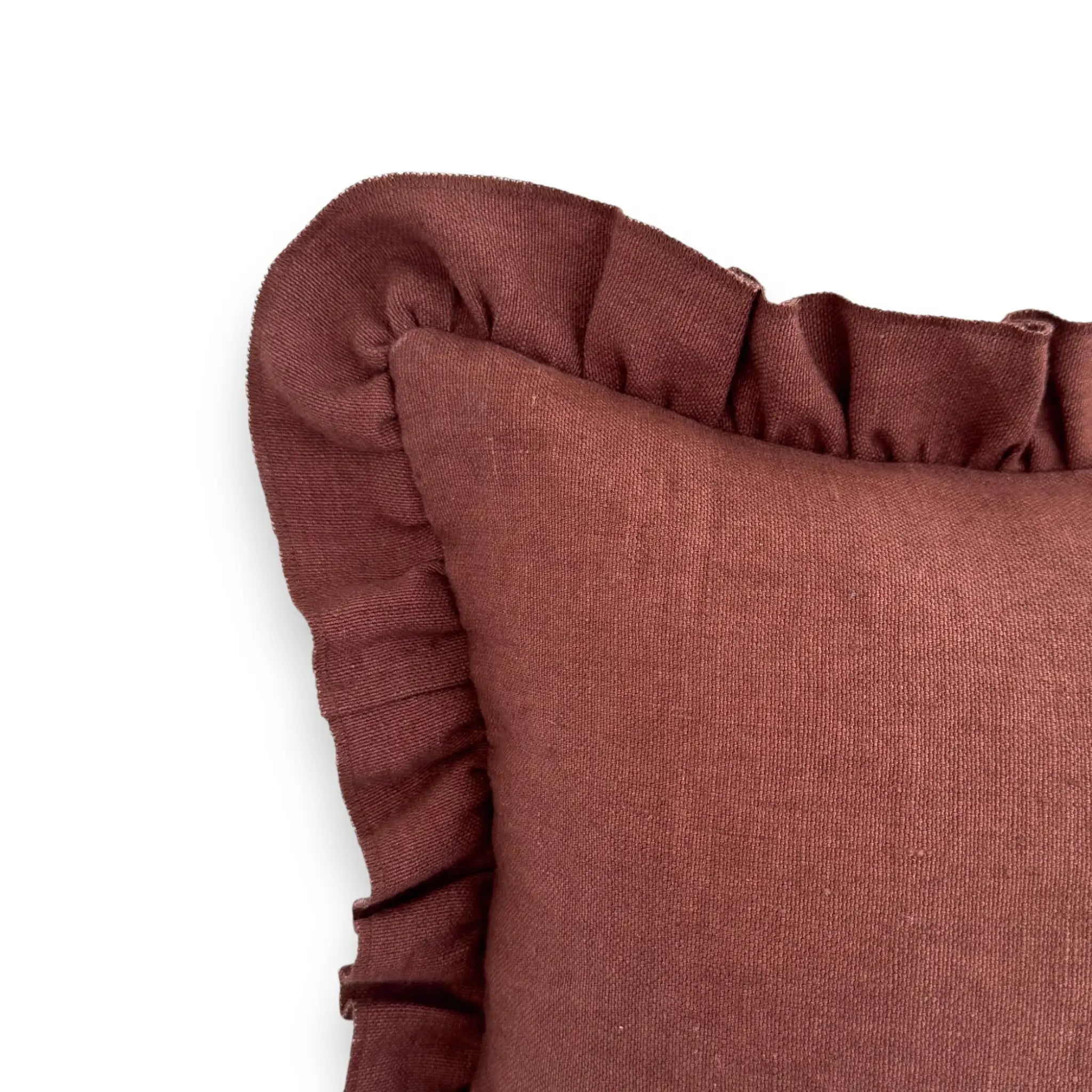 Detail view of dark red frill cushion