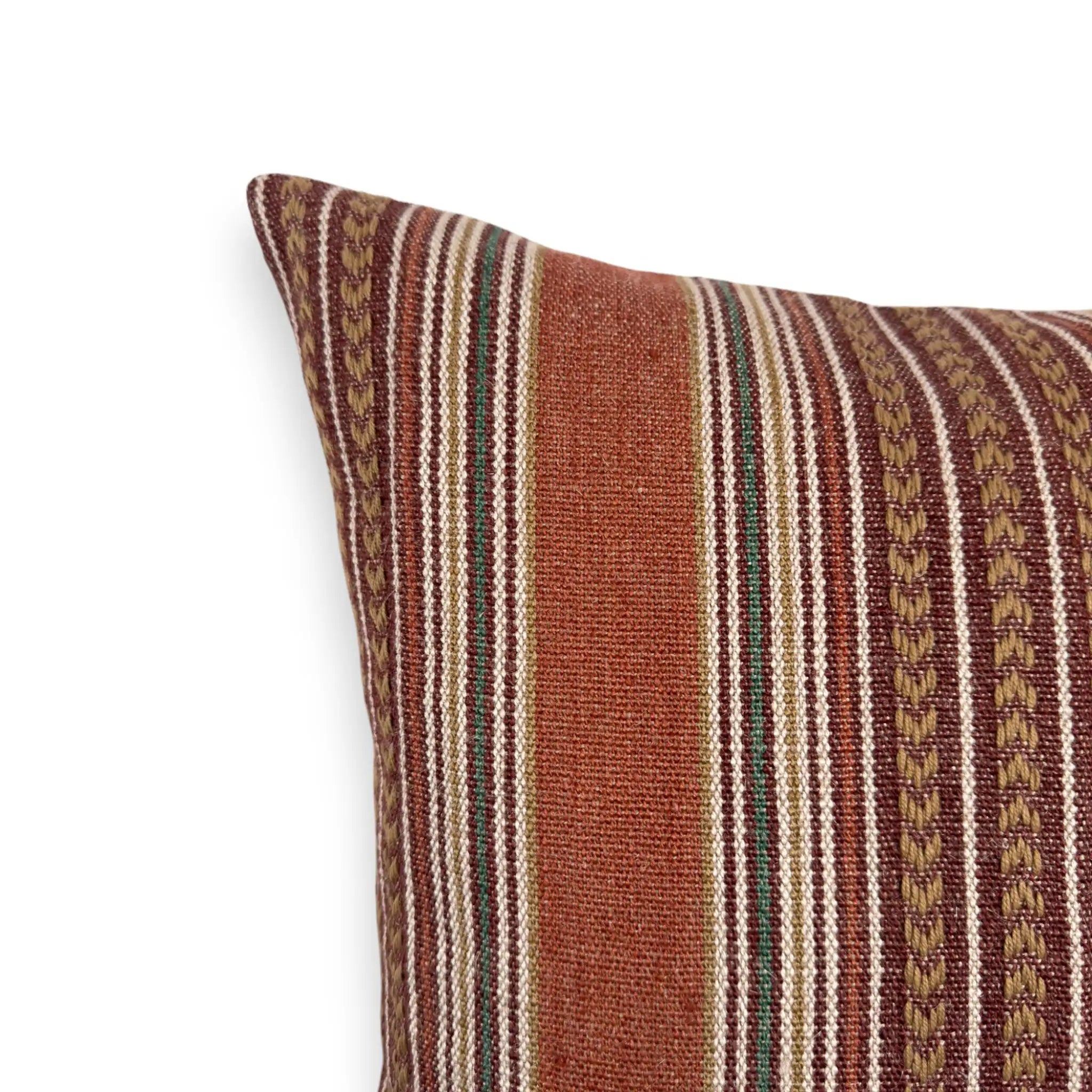 Detail view of a bohemian red striped cotton and jute cushion cover