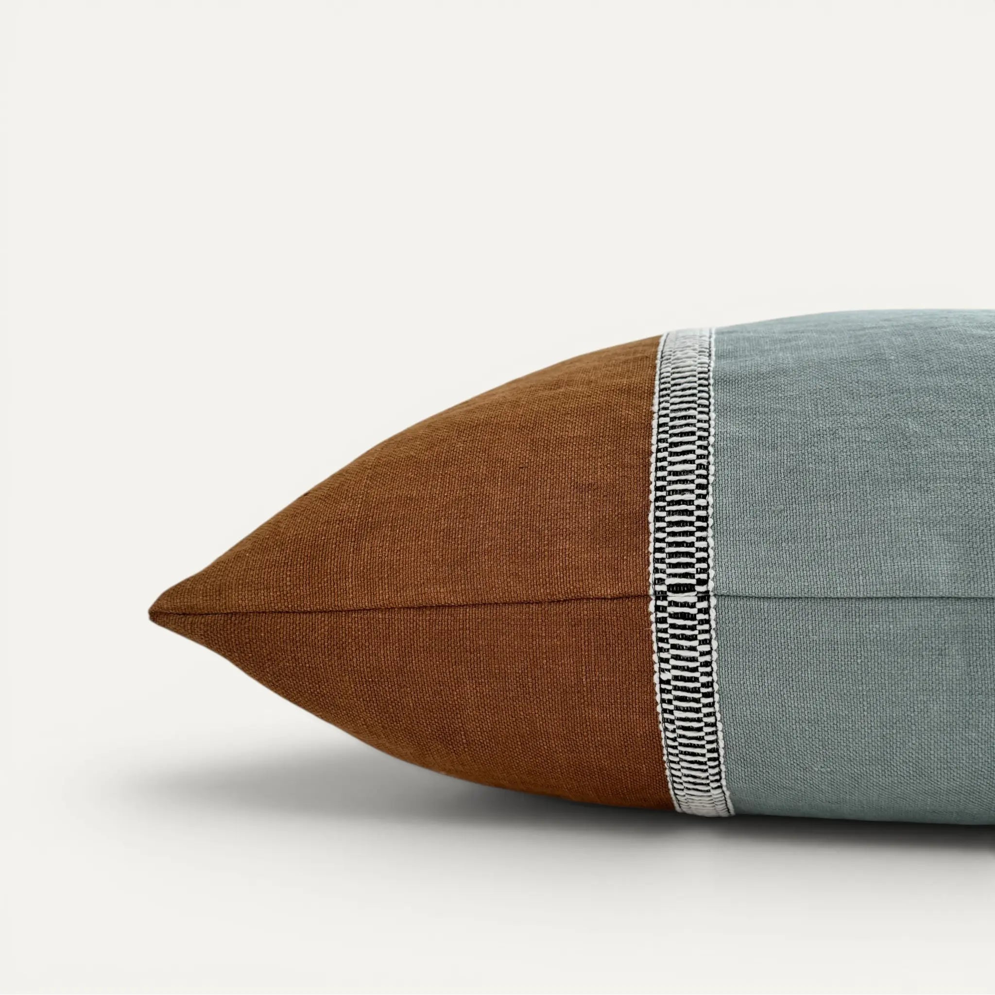 Side view of duck egg blue and brown stonewashed linen cushion cover